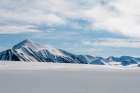 Snow streaked mountains on the island of Spitsbergen Norway Art Print